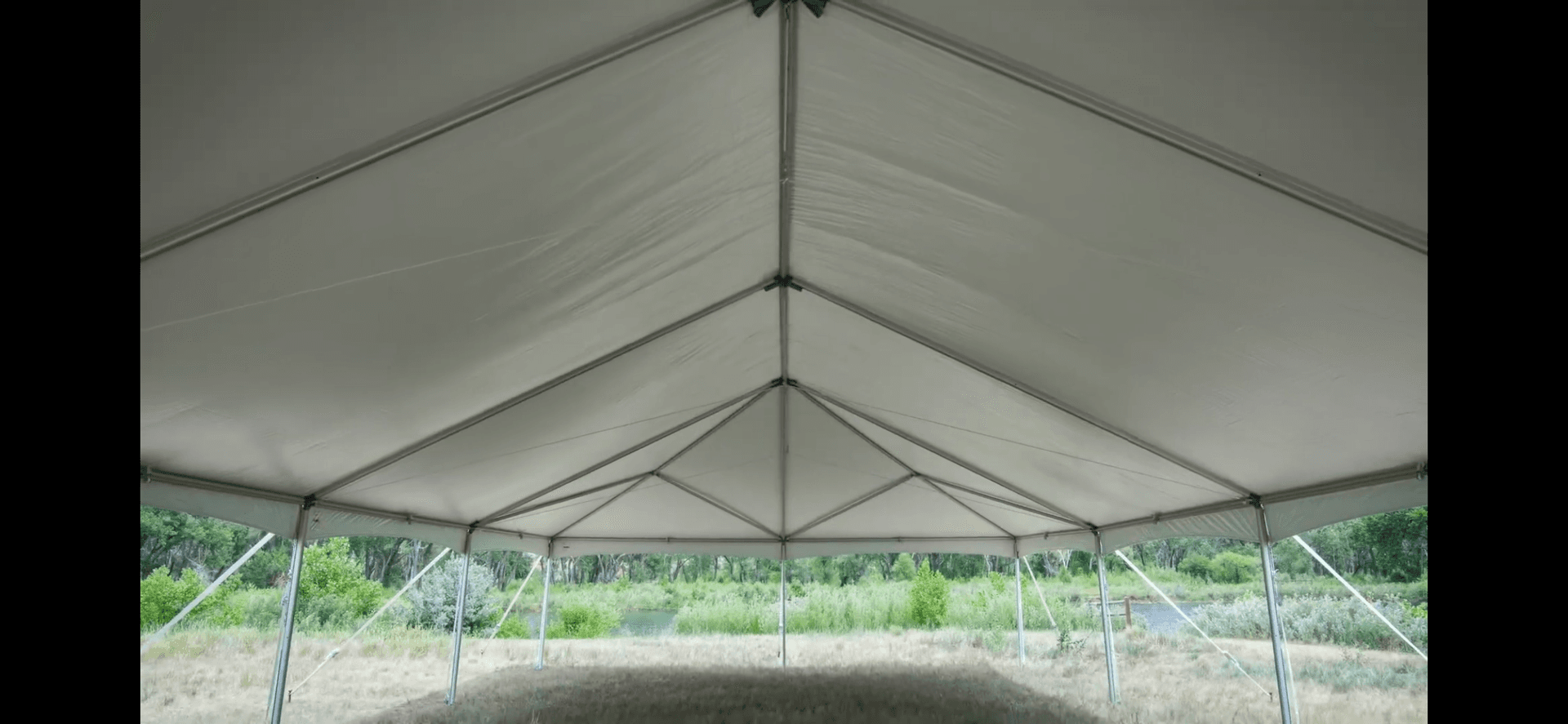Large white frame tent on grass for an outdoor event in the Glastonbury, Connecticut area