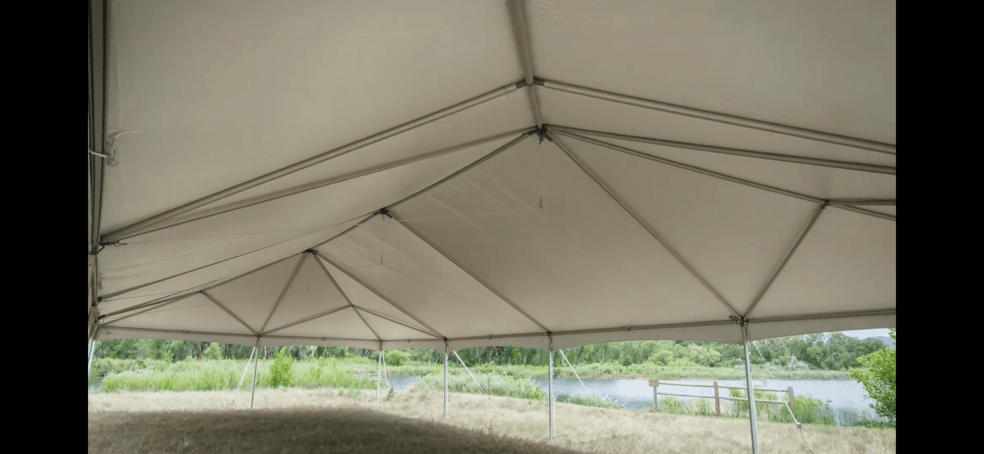 Navitrac style frame tent on grass for an outdoor gathering in the Glastonbury, Connecticut area